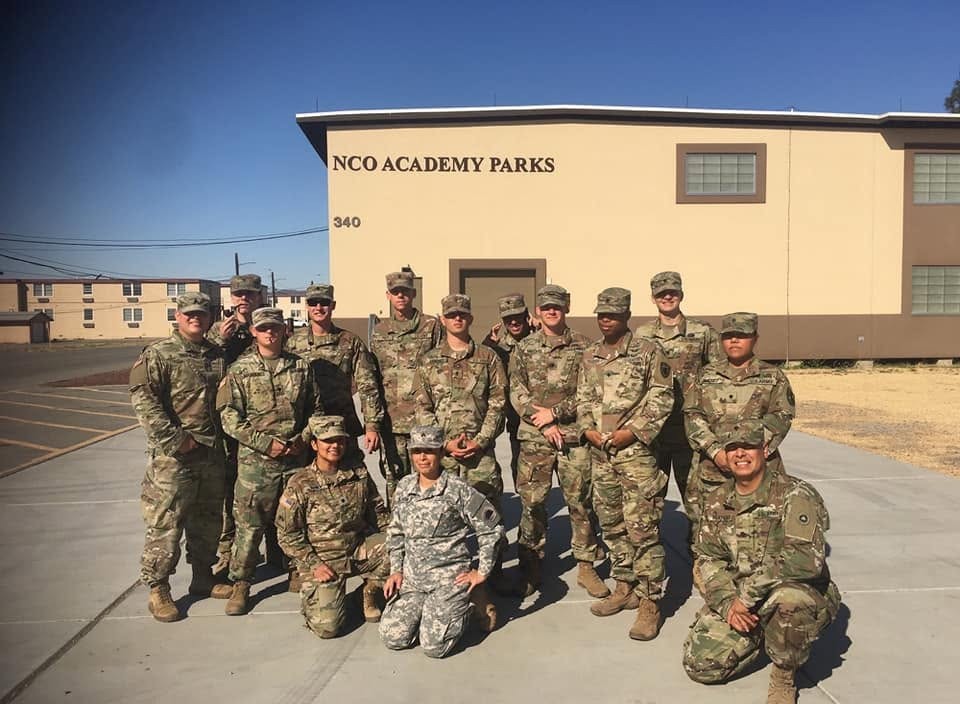 Military group outside NCO Academy Parks