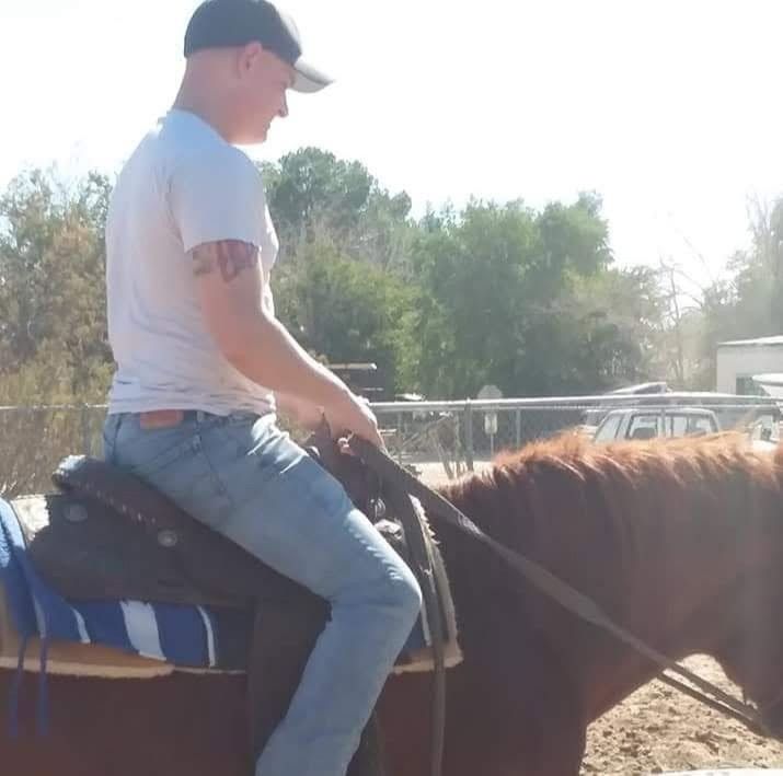 Robbie riding a horse
